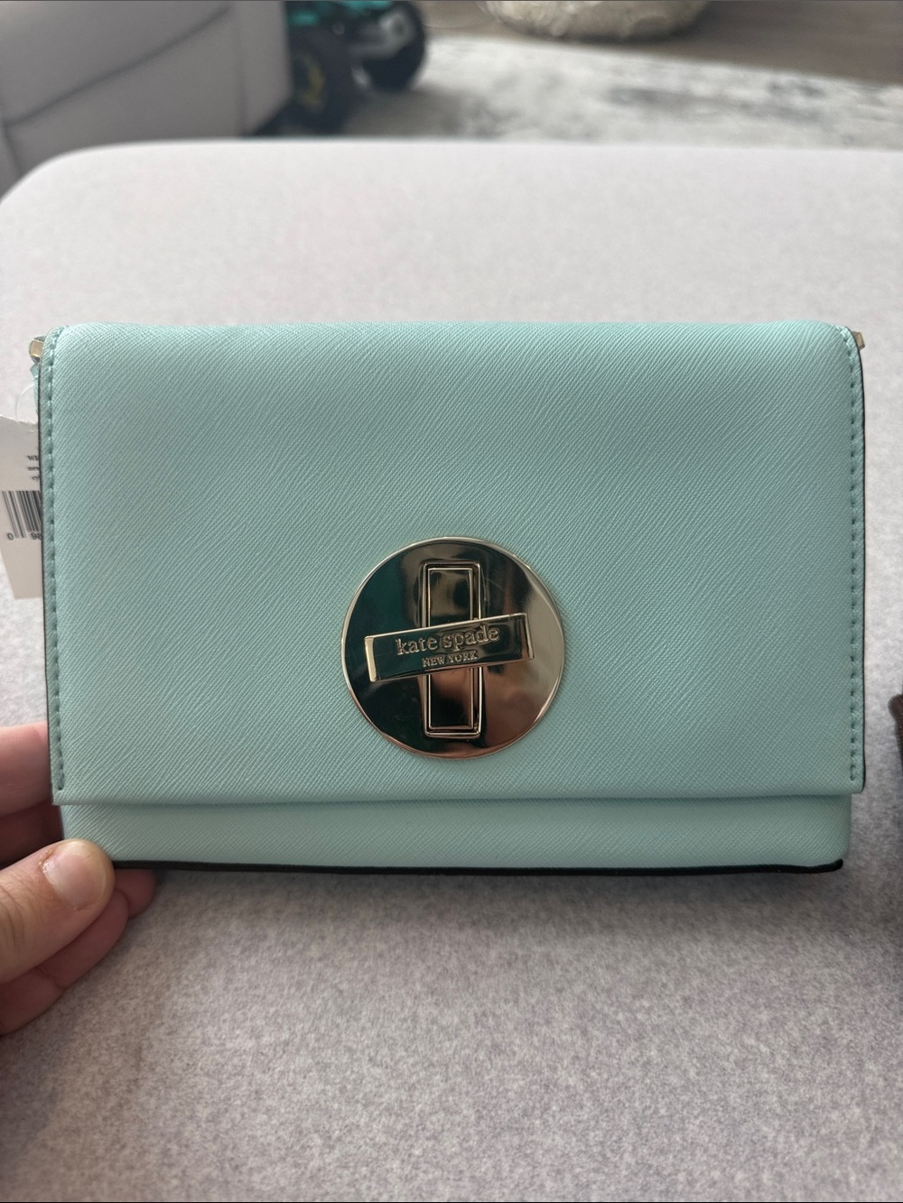kate spade mint green Saffiano clutch with silver logo turnlock